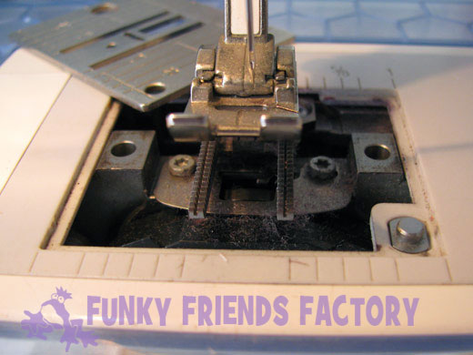 remove the needle plate dust fluff lint in sewing machine